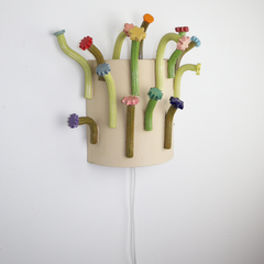 36 - Hanna Dís Whitehead, "Flower flower wall Sconce", Handbyggður og pressaður steinleir og glerungu, 48x38x13cm, 2025.