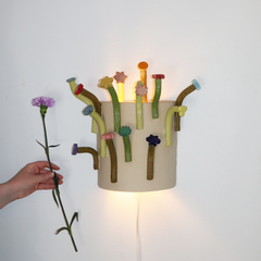 36 - Hanna Dís Whitehead, "Flower flower wall Sconce", Handbyggður og pressaður steinleir og glerungu, 48x38x13cm, 2025.